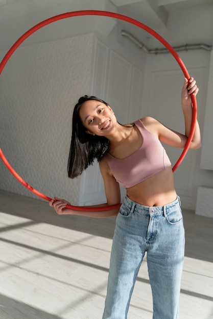 Young woman with hula hoop