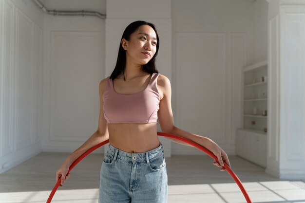 Young woman with hula hoop