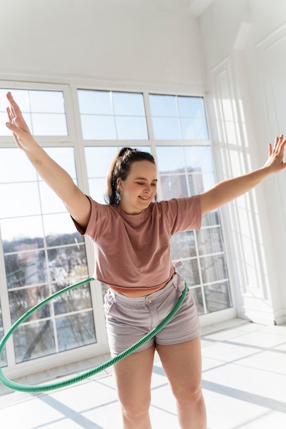 Young woman with hula hoop