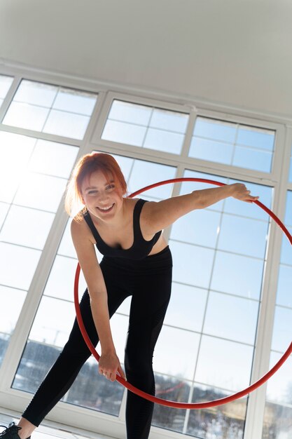 Young woman with hula hoop