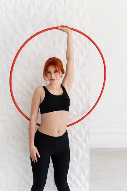 Young woman with hula hoop