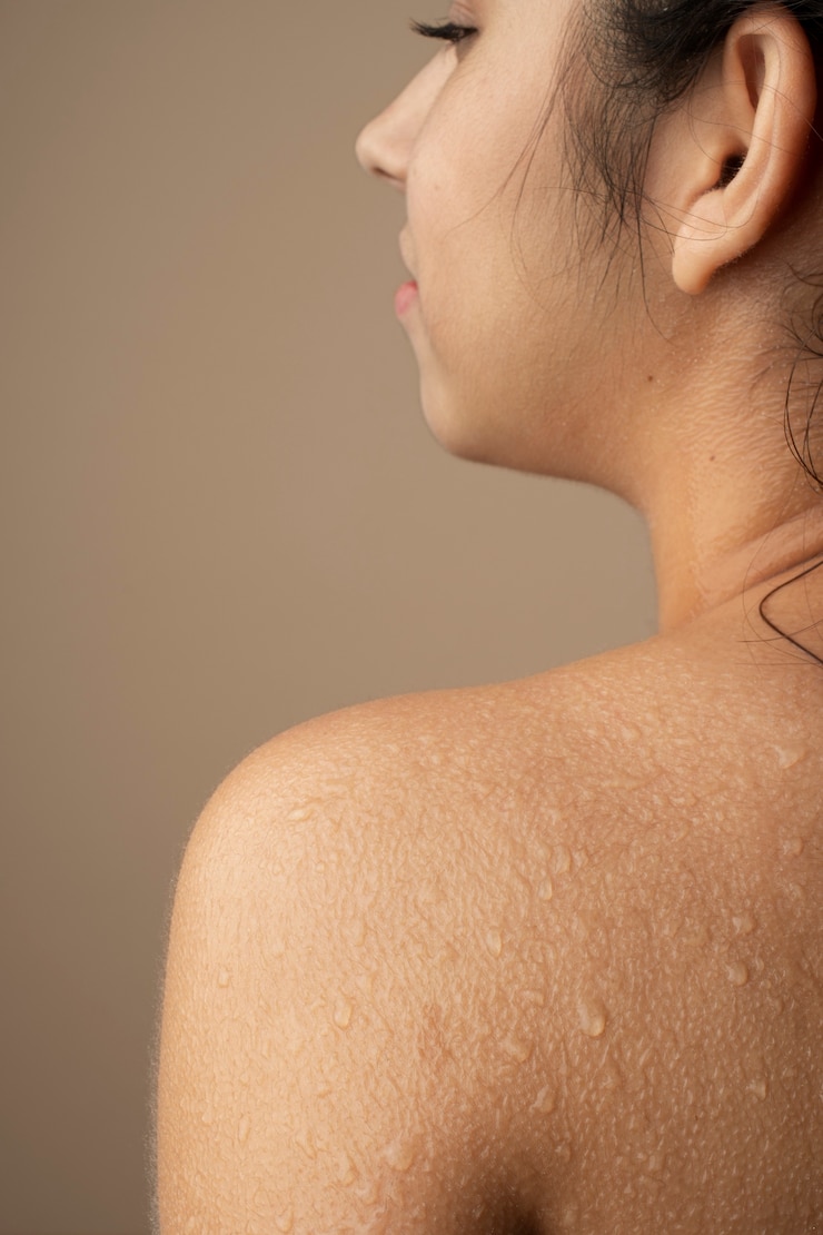 Free Photo young woman with hydrated skin