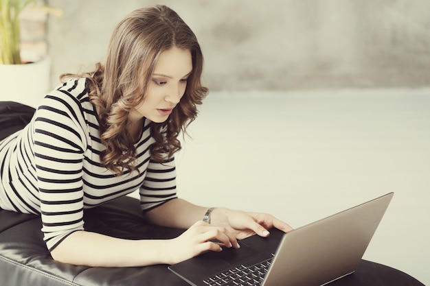 Young woman with laptop pc computer