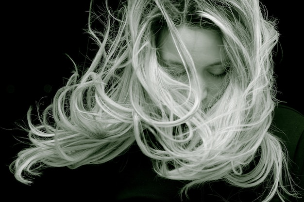 Young woman with long hair posing