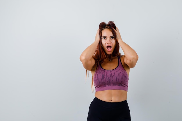 Young woman with long hair wearing sportswear