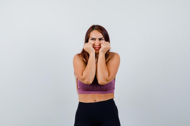 Young woman with long hair wearing sportswear