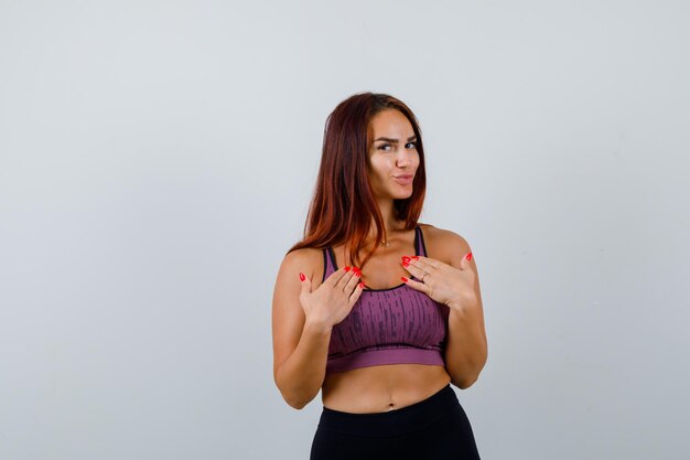 Young woman with long hair wearing sportswear