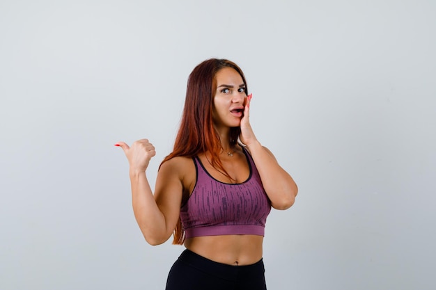 Young woman with long hair wearing sportswear