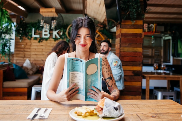 Young woman with menu