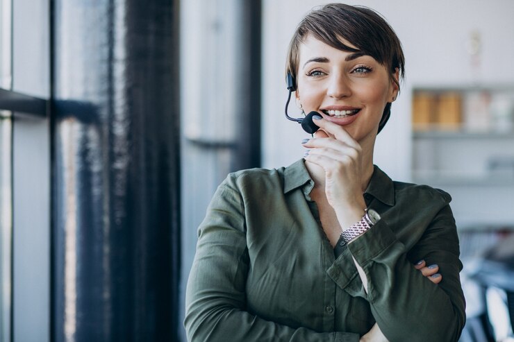 Free Photo young woman with microphone working on record studio