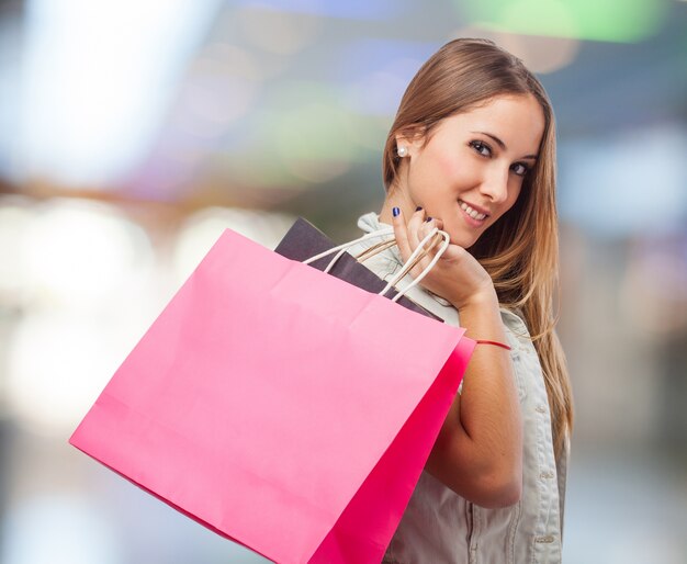 Young woman with a pink bag