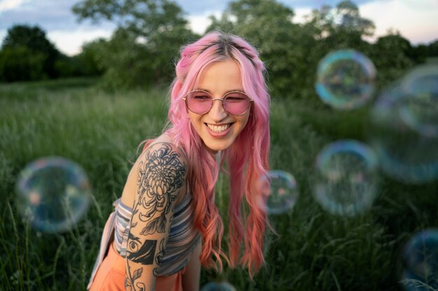 Young woman with pink hair smiling