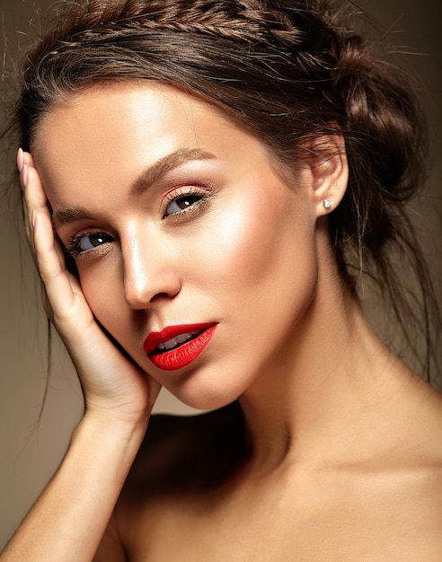 Young woman with red lips and wavy hairstyle