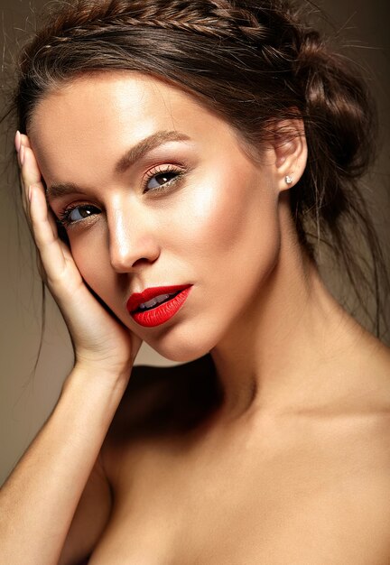 Young woman with red lips and wavy hairstyle