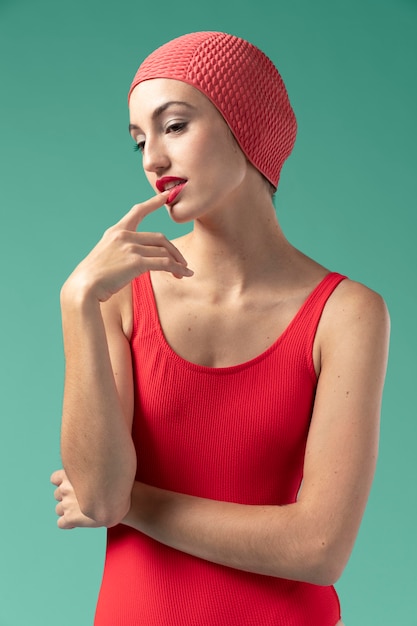 Free photo young woman with red swimsuit