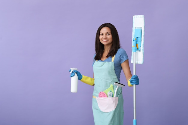 Young woman with rubber gloves, ready to clean