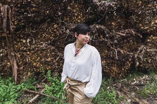 Young woman with short hair looking left