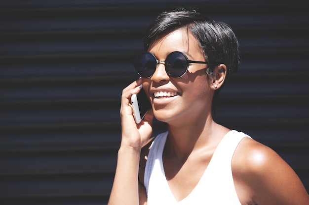 Young woman with short hair talking on the phone