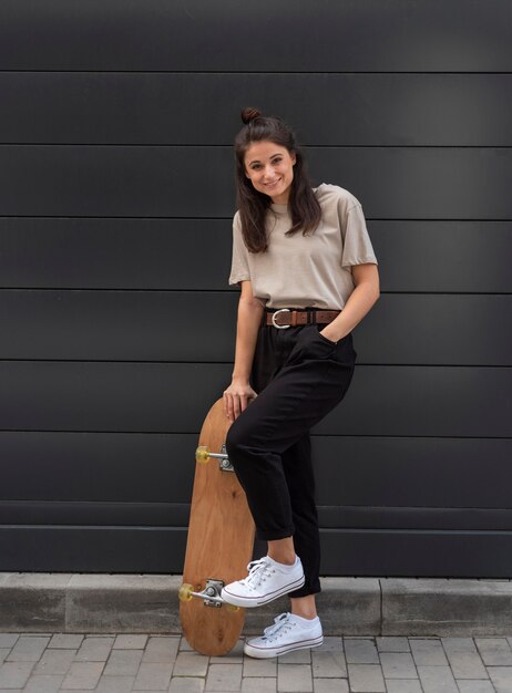 Young woman with skateboard