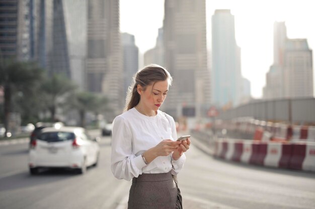 young woman with a smartphone in dubai