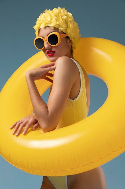 Young woman with swimming cap and glasses