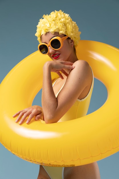 Young woman with swimming cap and glasses