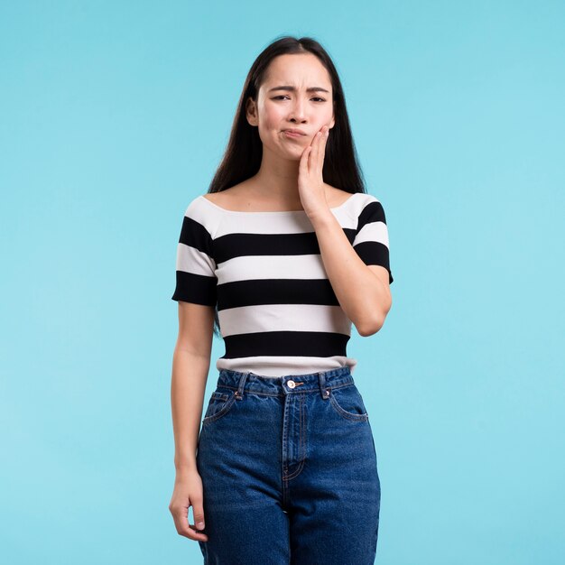 Young woman with tooth pain