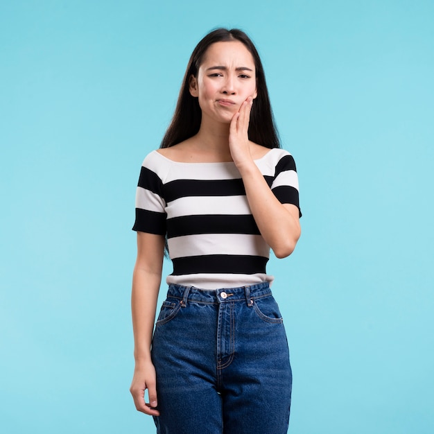 Young woman with tooth pain