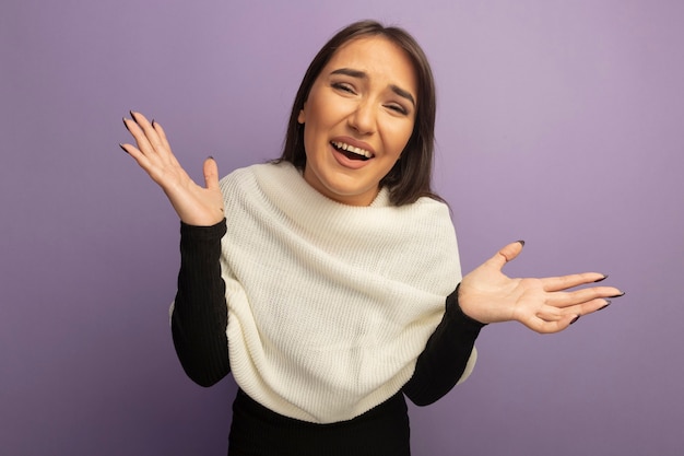 Young woman with white scarf smiling spreading arms to the sides 