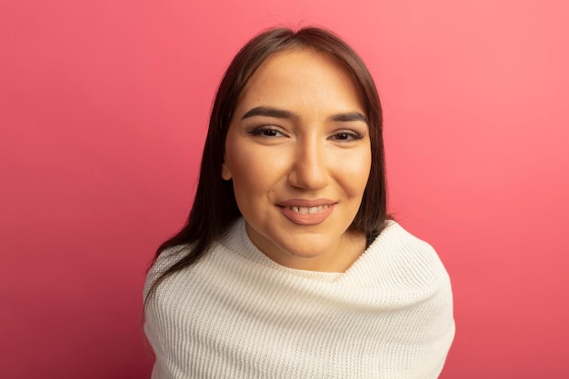 Young woman with white scarf with smile on face 