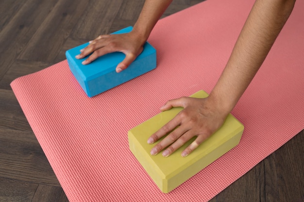 Young woman with yoga essentials