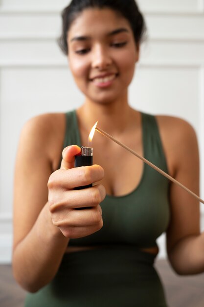 Young woman with yoga essentials