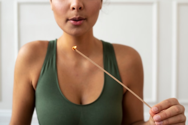 Free photo young woman with yoga essentials