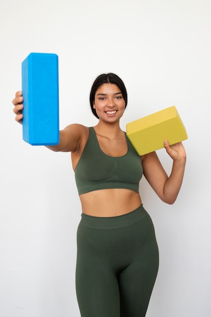 Young woman with yoga essentials