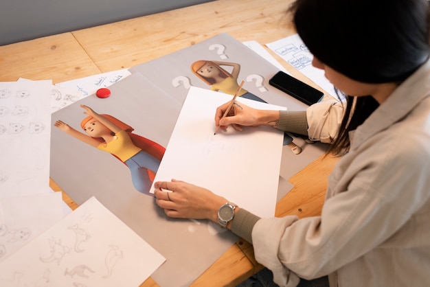 Free photo young woman working in an animation studio