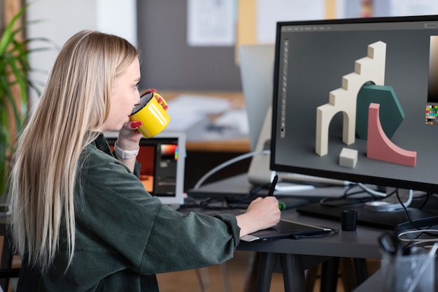 Free photo young woman working in an animation studio