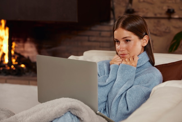 Free photo young woman working from home