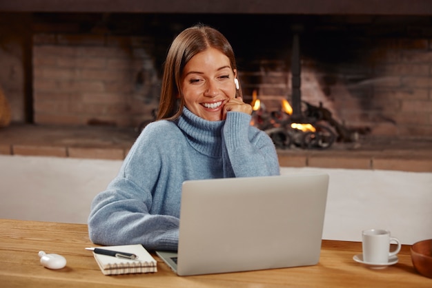 Free photo young woman working from home