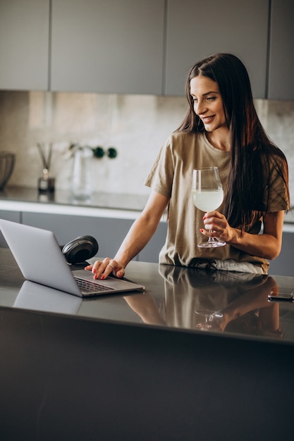 Young woman working on laptop from home