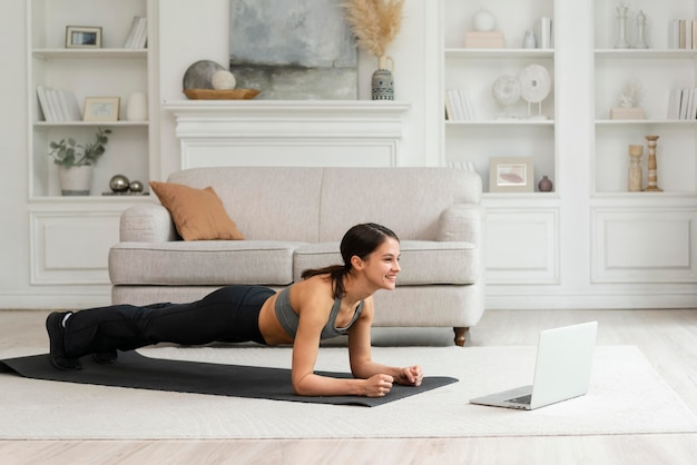 Young woman working out at home