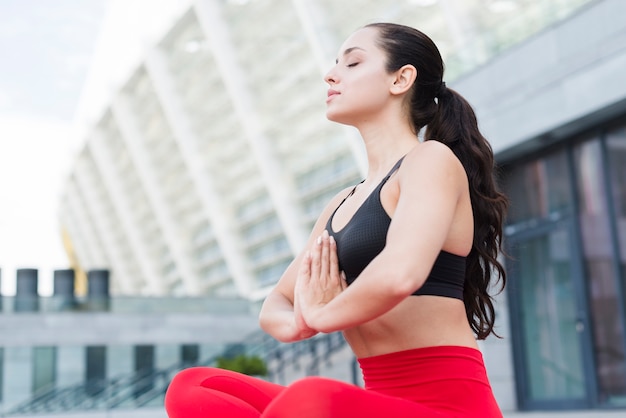 Young woman working out at the street