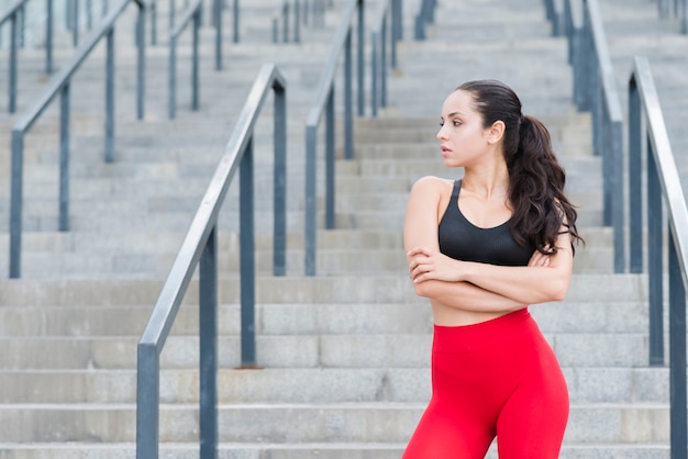 Young woman working out at the street