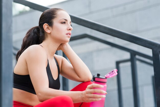 Young woman working out at the street