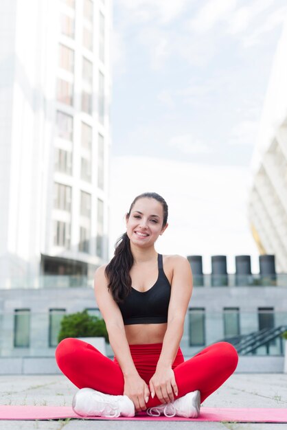 Young woman working out at the street