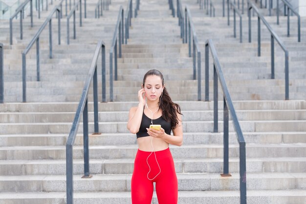 Young woman working out at the street