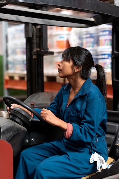 Free photo young woman working in a warehouse