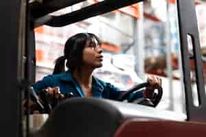 Free photo young woman working in a warehouse