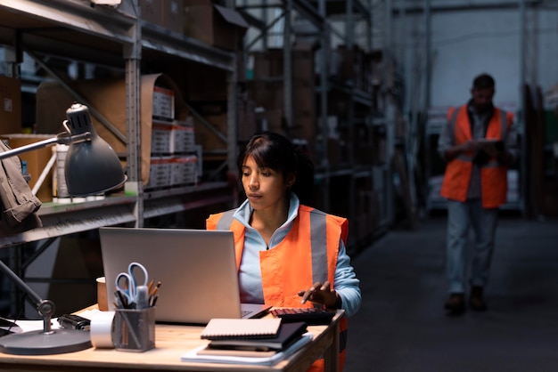 Free photo young woman working in a warehouse