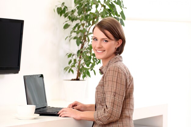 Young woman working with laptop