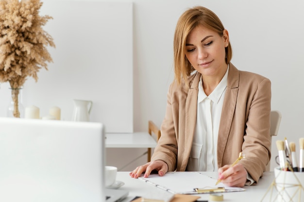 Young woman writing a book